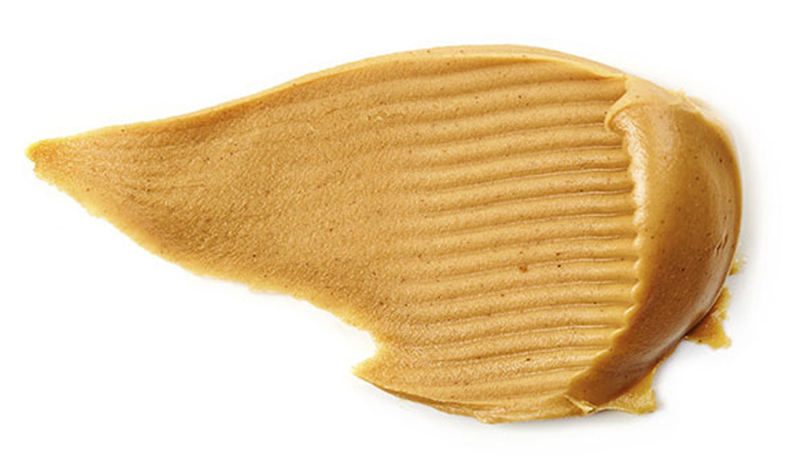 peanut butter spread isolated on white
